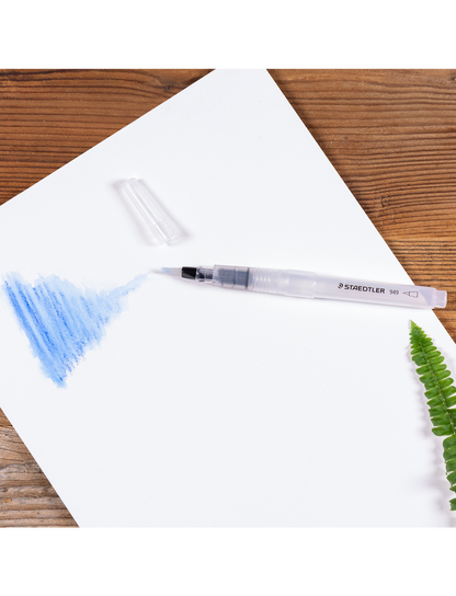 Water brush for aquarelle, staedtler 949, in use on paper with aquarelle
