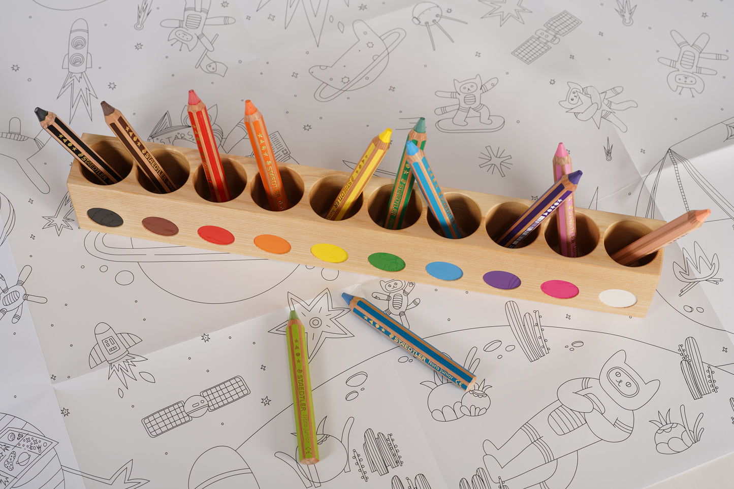 Large montessori pencil holder, with staedtler noris pencils for small kids,  on top of space kittens giant colorig poster