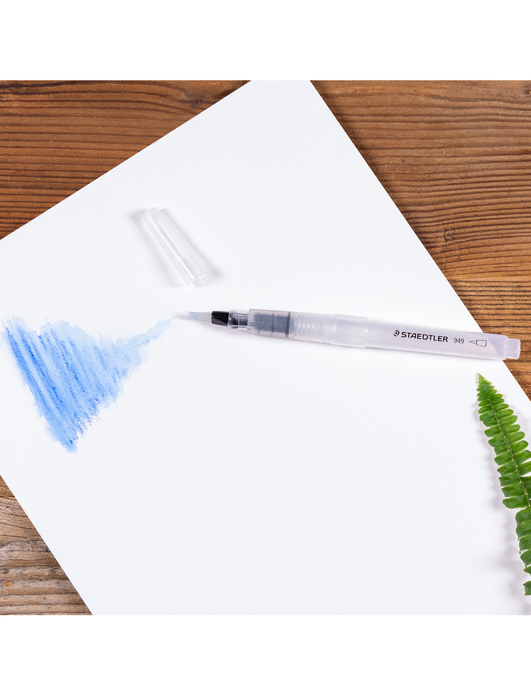Water brush for aquarelle, staedtler 949, in use on paper with aquarelle