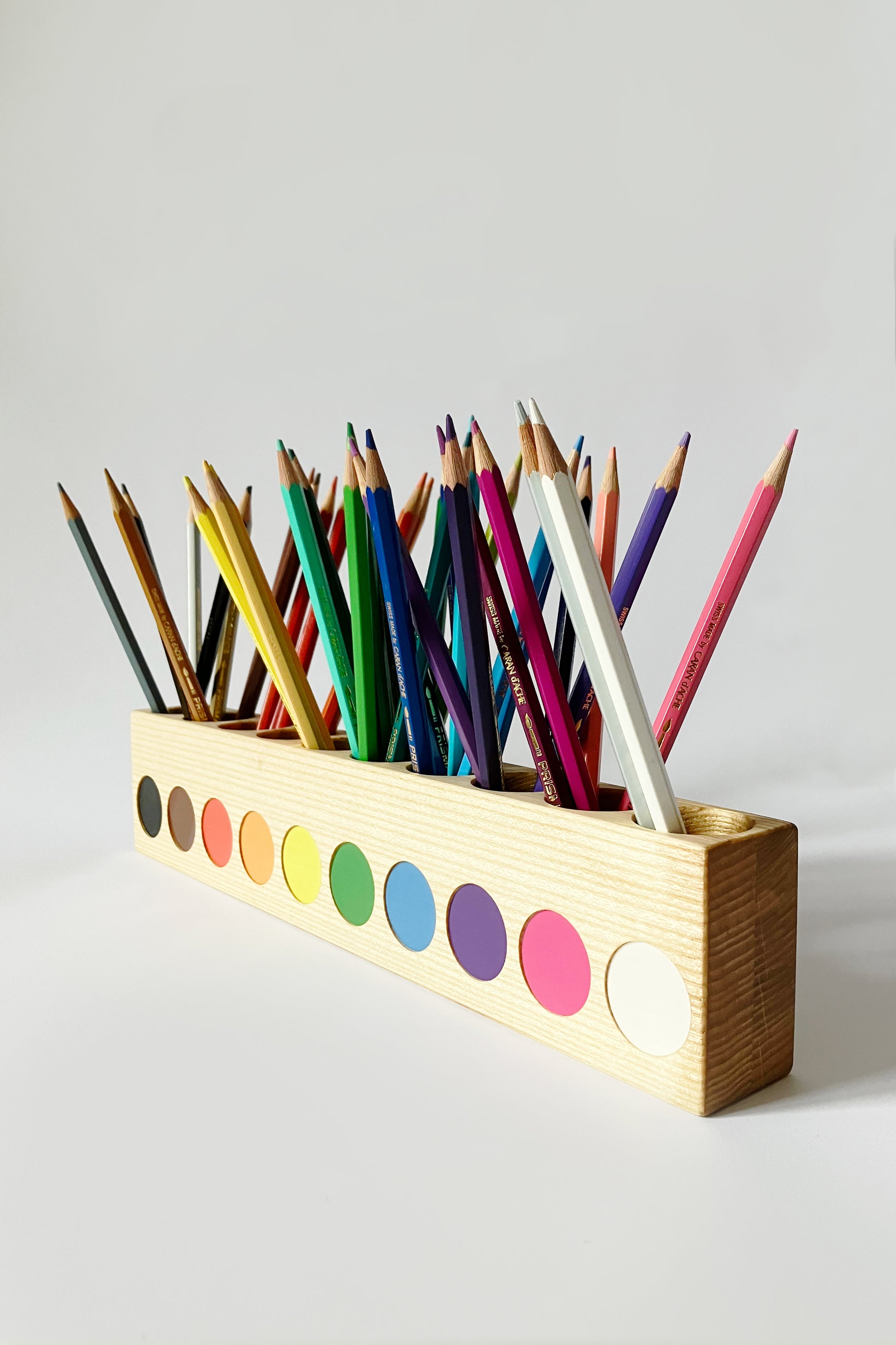 Montessori pencil holder, view from right side at an angle, white background