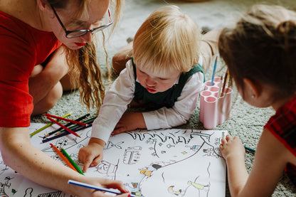 XXL giant coloring poster Latvian traditions, isbn 978-9934-8993-1-7,  children coloring the poster with their mother using caran d'ache pencils